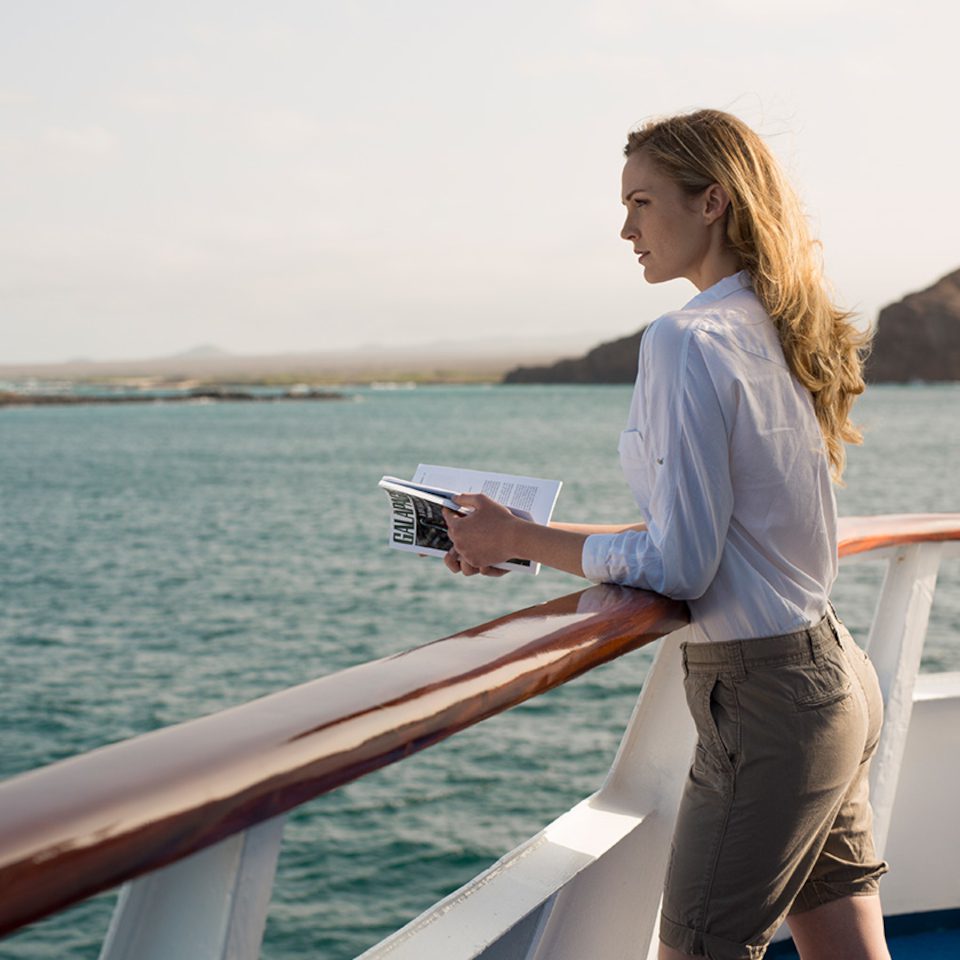Sun Deck Woman Aboard Yacht Isabela II Galapagos Islands