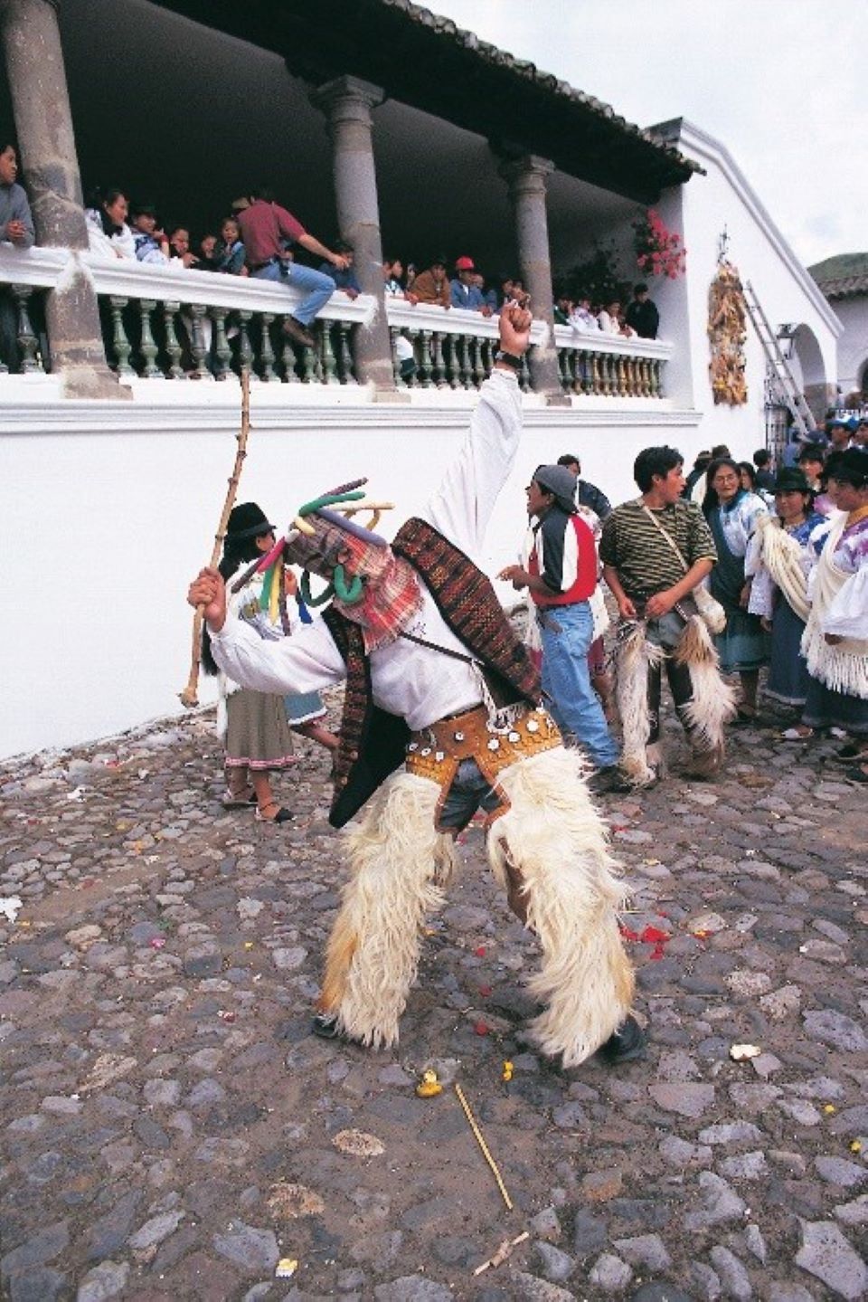 Carnaval En Guaranda, Un Hombre Bailando Con Su Máscara De Aya Uma Y Pantalones Chagra.