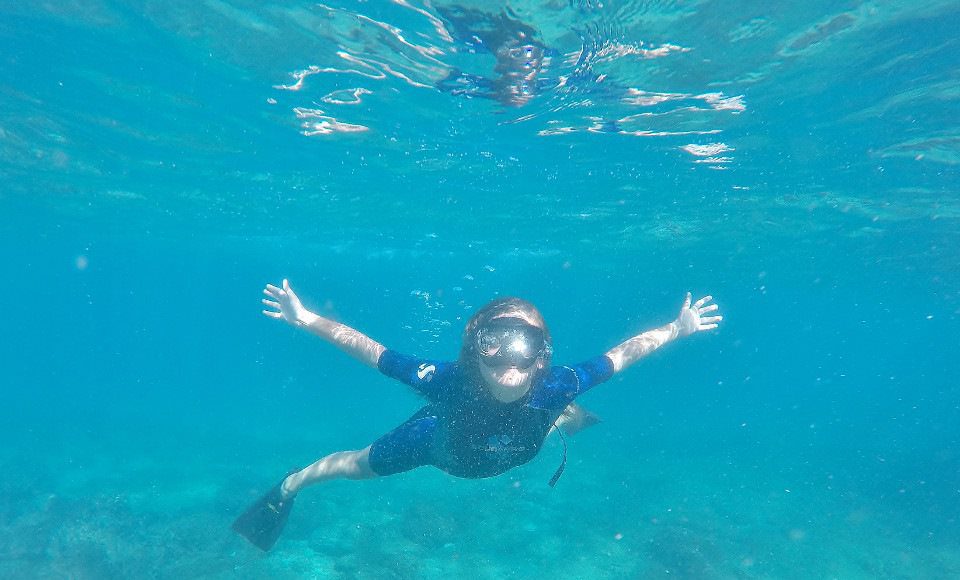 Kid Snorkeling In Galapagos