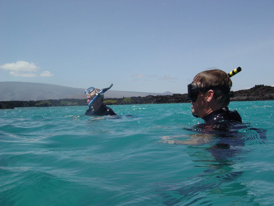 Guests Snorkeling In Galapagos.