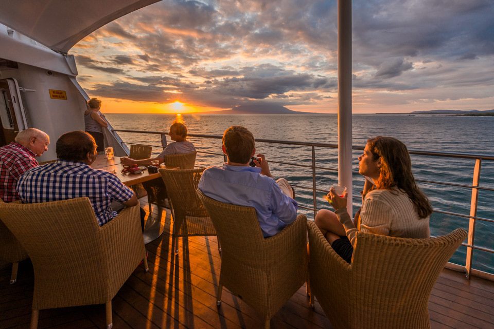 Santa Cruz Ii Cruise's Guests Enjoying Their Gourmet Dinner And The Sunset.