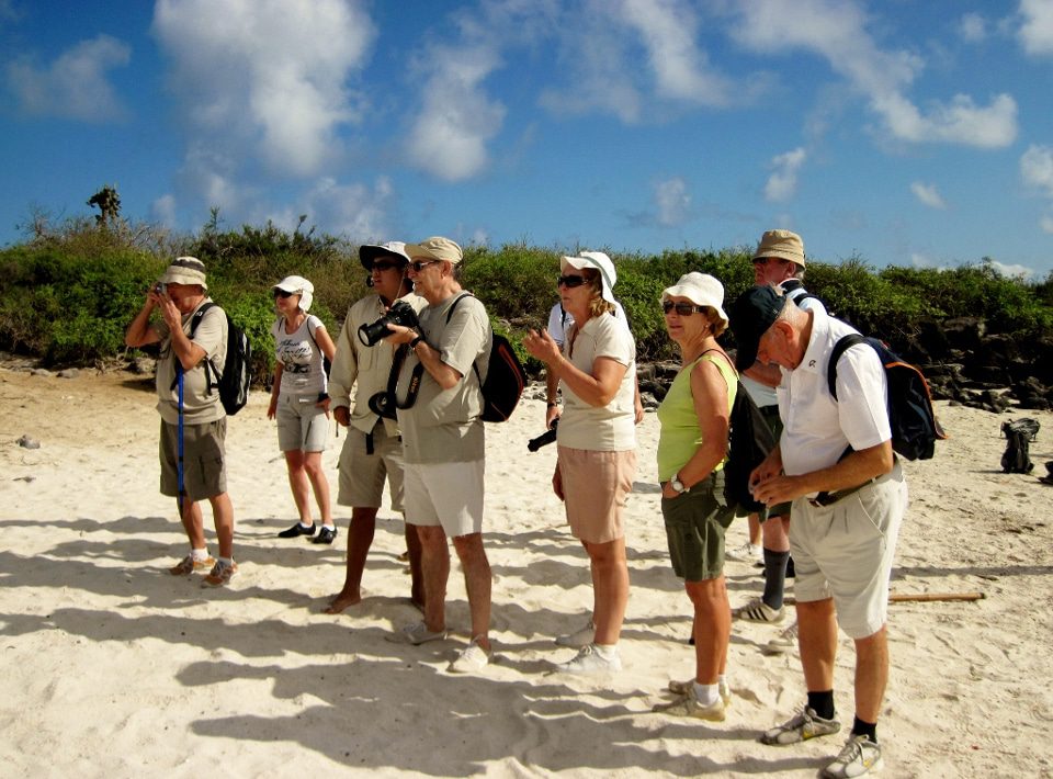 Guests Taking Photos While Exploring The Galapagos Islands