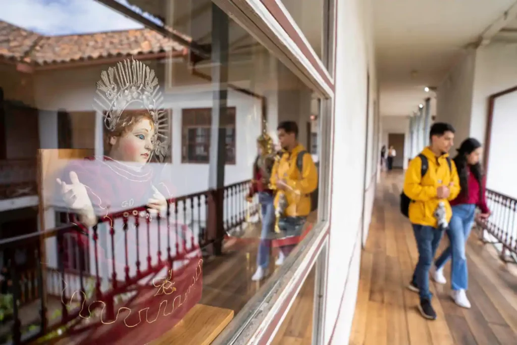Religious statue in a glass display case at Museo de las Conceptas