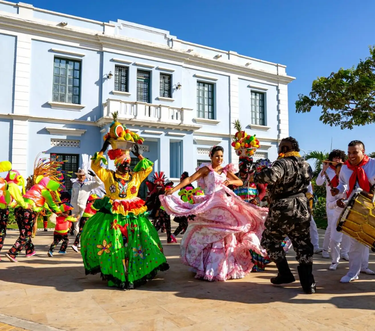 Costumed dancers with fruit-basket headdresses performing a traditional cumbiamba Costumed dancers with fruit-basket headdresses performing a traditional cumbiamba