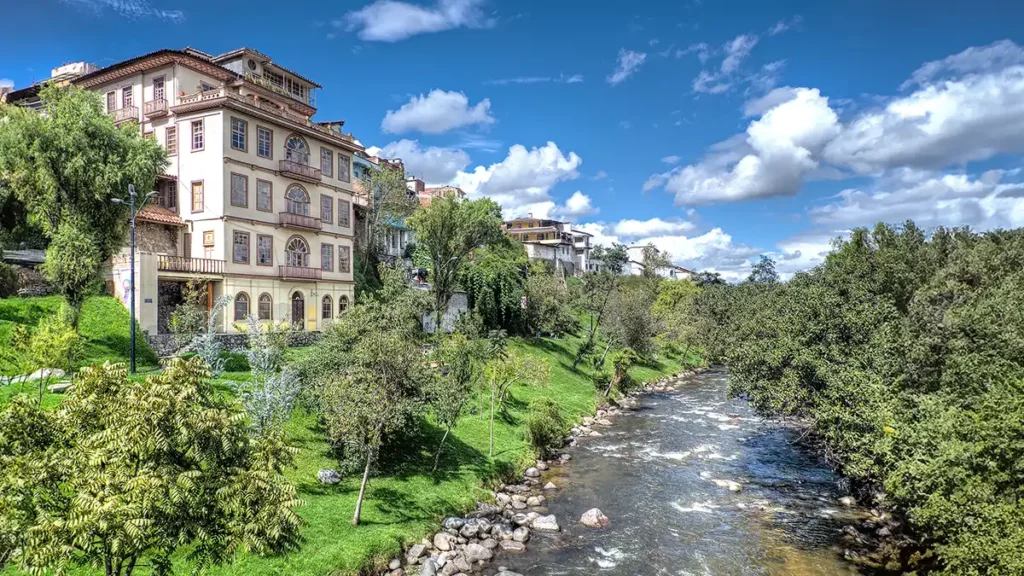 Colonial buildings overlooking the Tomebamba River in El Barranco, Cuenca