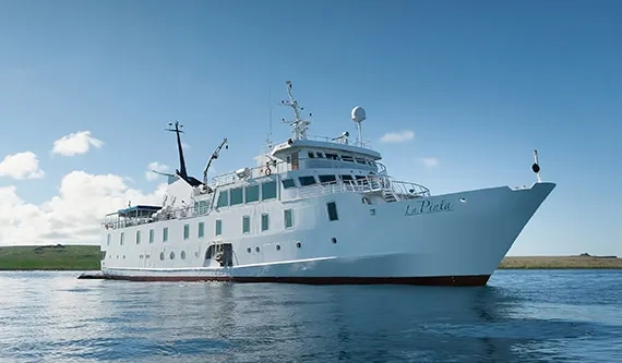 Yacht La Pinta expedition ship for Galapagos cruises anchored off the islands