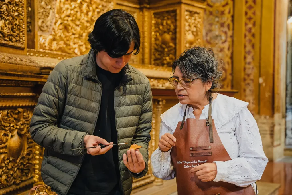 Yolanda teaching the gold-leaf technique inside La Compania church