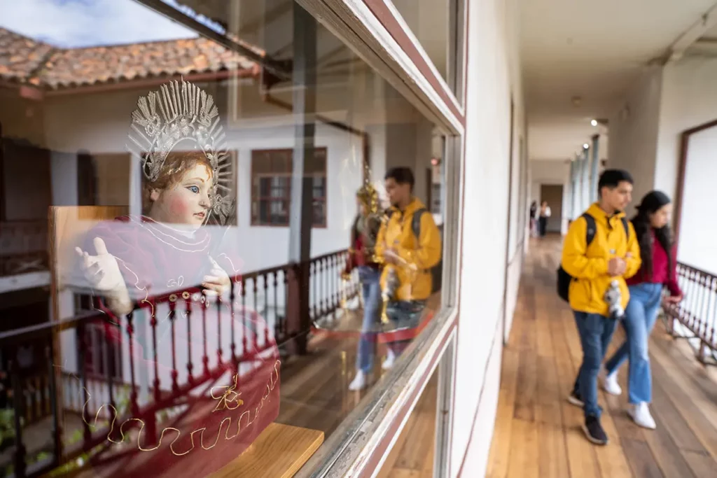 Religious statue in a glass display case at Museo de las Conceptas