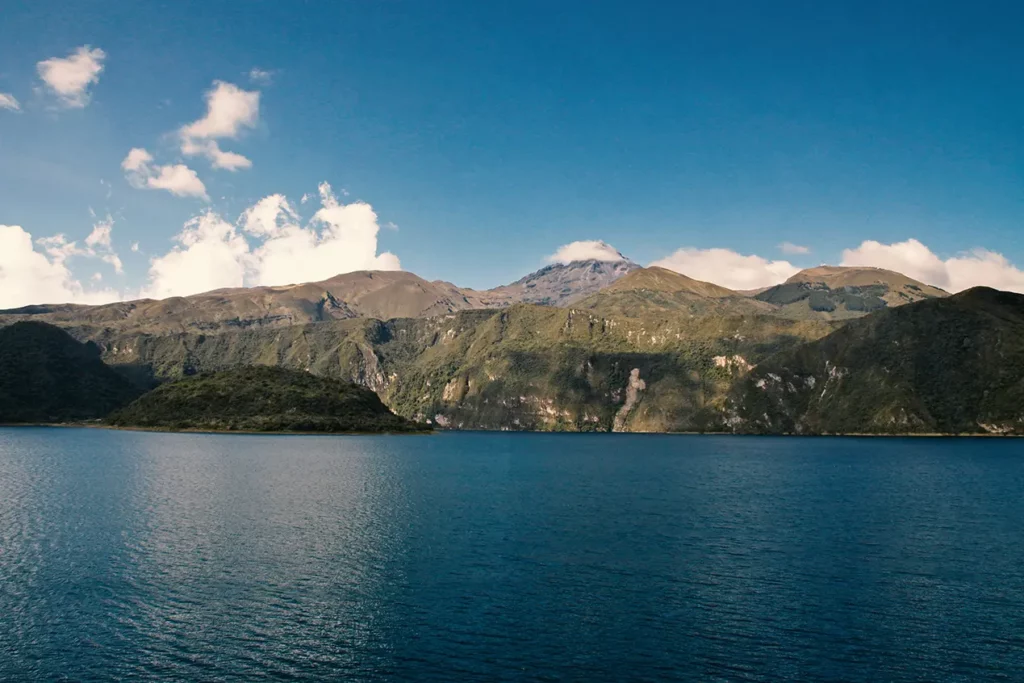 Cuicocha crater lake surrounded by volcanic peaks