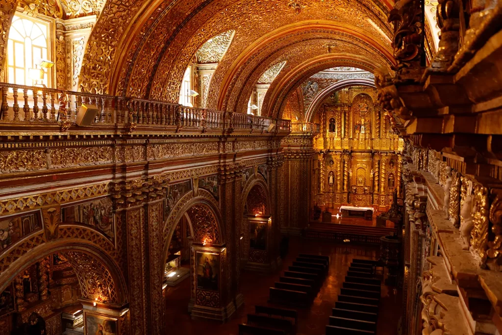 Gold-leaf nave and altar inside La Compania de Jesus church