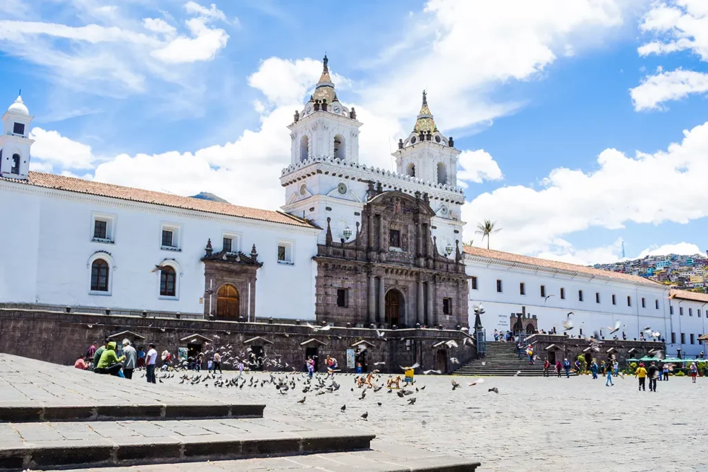 San Francisco Church and Convent facade with pigeons in the plaza