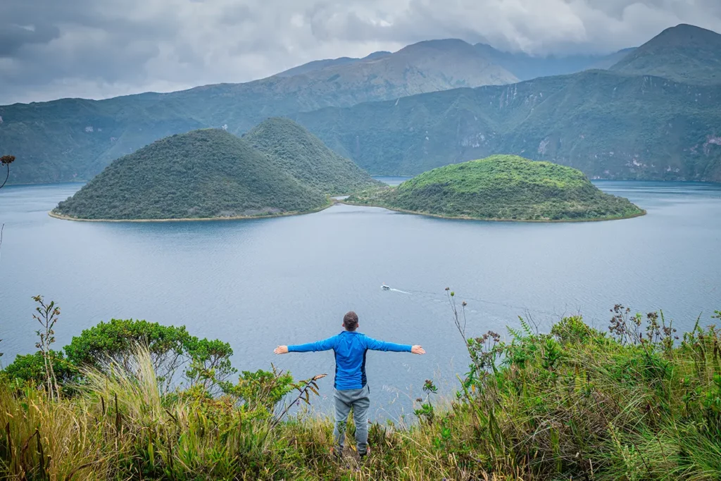Hiker on the Cuicocha crater rim trail, Ecuador