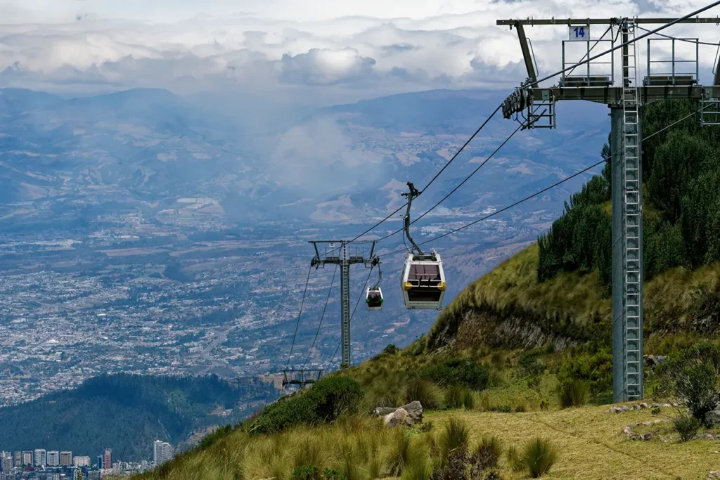 TeleferiQo cable car ascending above the Quito valley